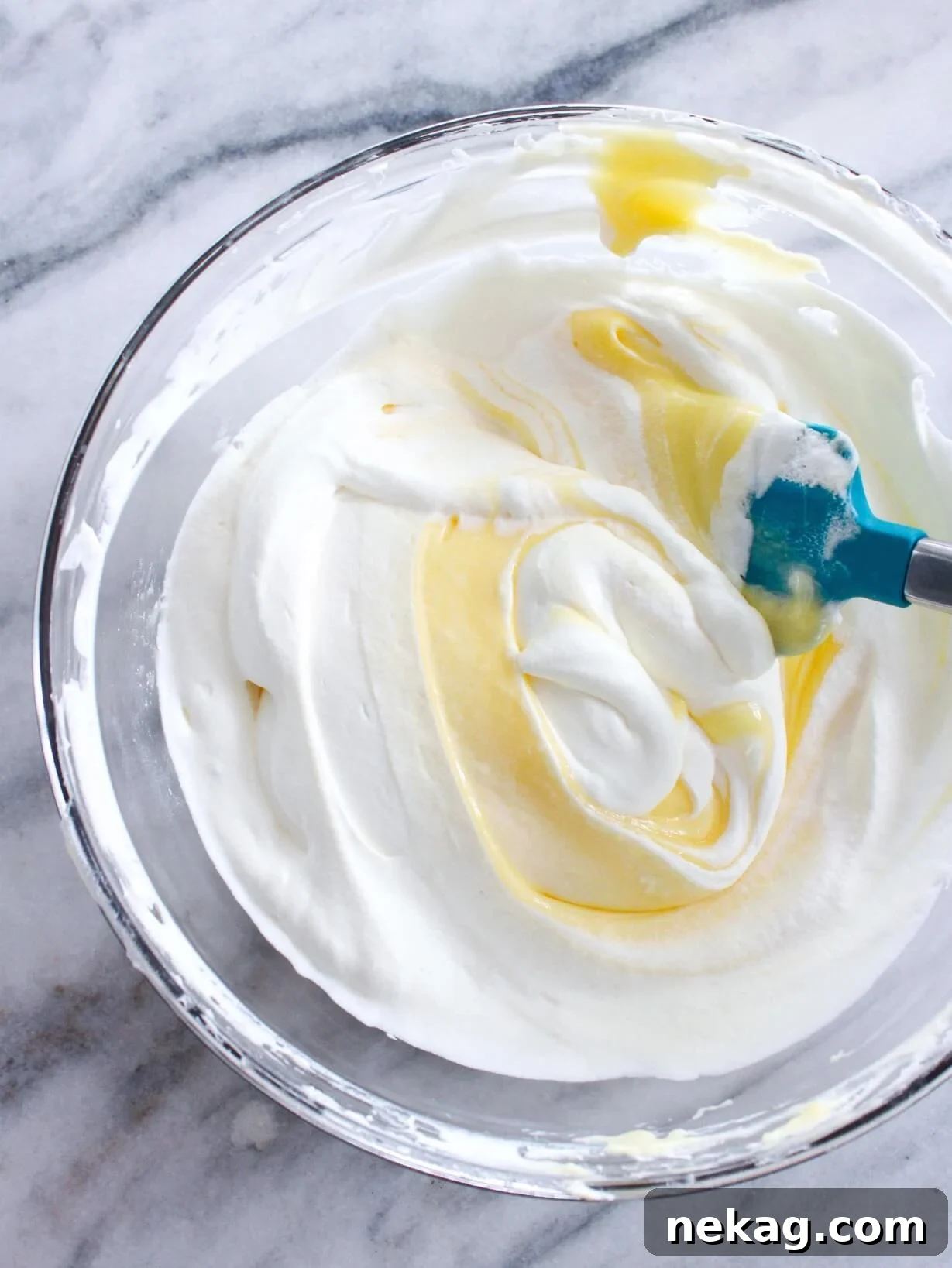 Zesty Lemon Cream Delight 2 Silky smooth lemon curd whipped cream on a marble slate, ready to be served.
