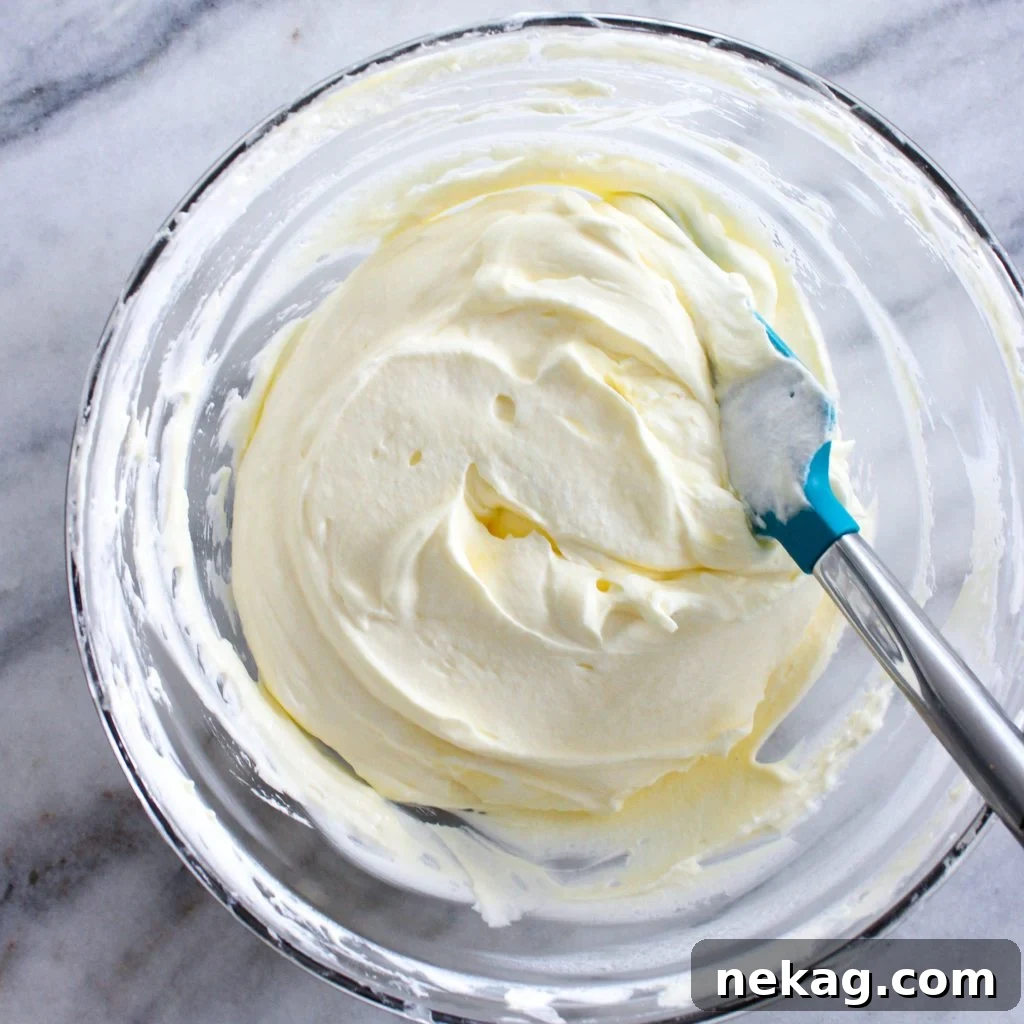 Zesty Lemon Cream Delight 5 Lemon whipped cream in a small serving dish, garnished with lemon zest.
