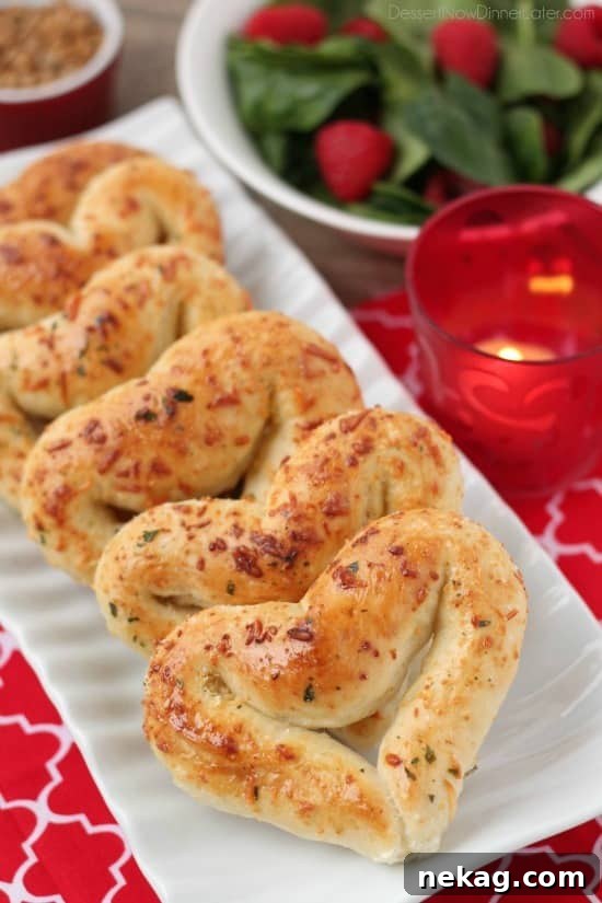 Heart Shaped Breadsticks stacked on a plate, ready to be served.
