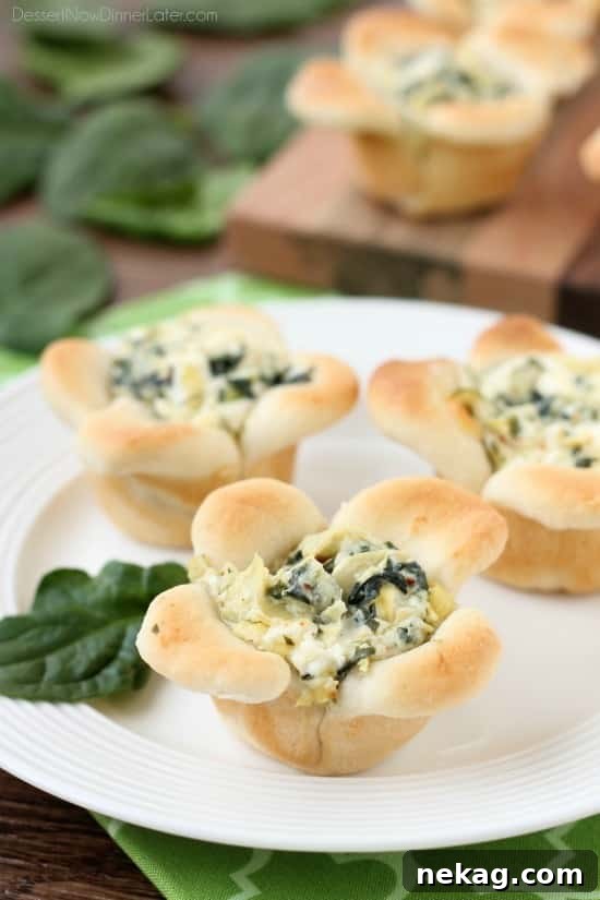 Artichoke Spinach Blossom Bites 2 Creamy Spinach Artichoke Dip is baked in the center of bread cups that are shaped to look like blooming flowers. A fun and delicious Easter appetizer.