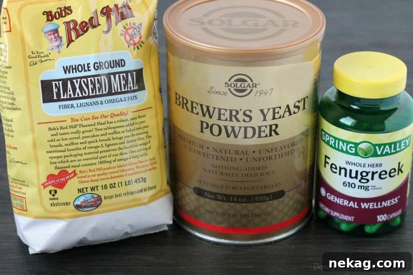 Three small bowls containing flaxseed, brewer's yeast, and fenugreek capsules, highlighting the key milk-boosting ingredients.