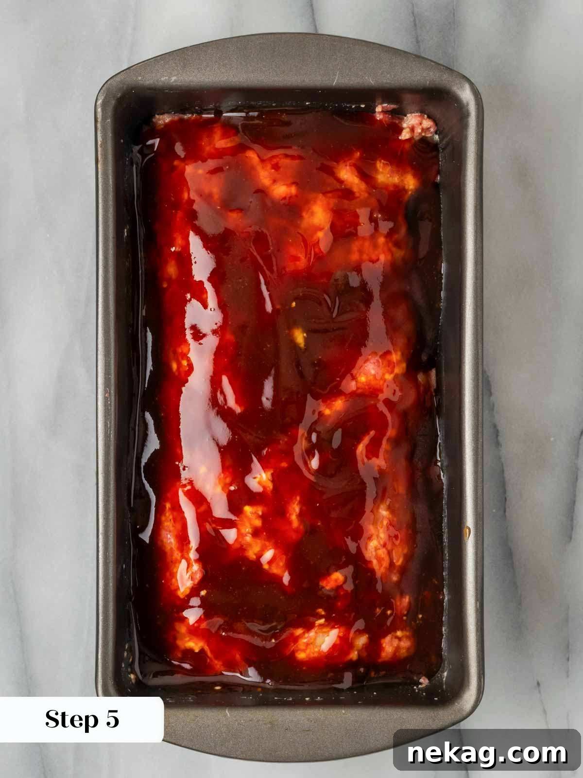 Sweet and Sticky Brown Sugar Meatloaf 7 unbaked glazed meatloaf in pan.