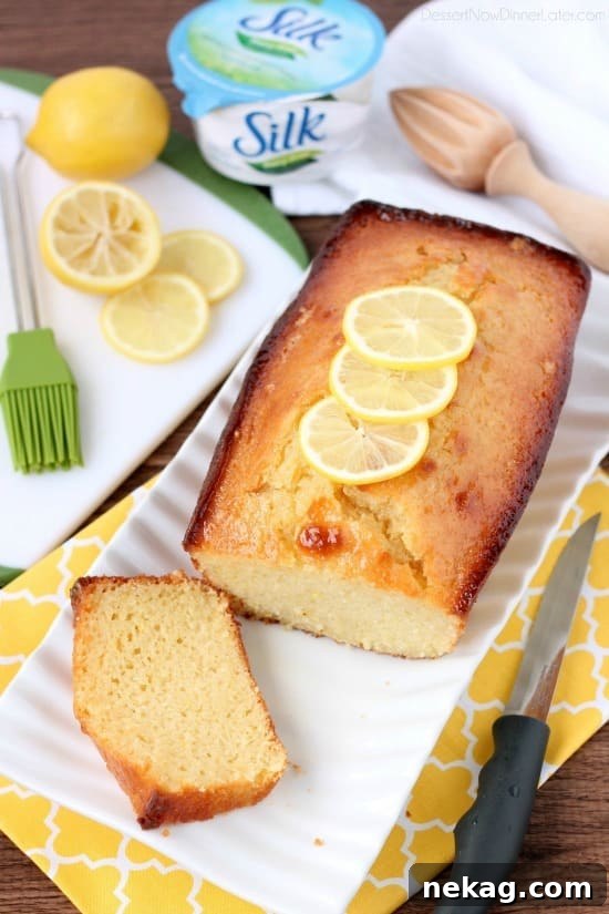 Dairy-Free Sunshine Lemon Yogurt Cake 8 A final shot of the dairy-free lemon yogurt cake on a wooden board.