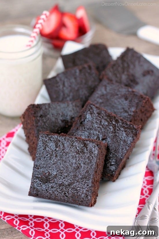 Close-up of a perfectly baked gluten-free coconut flour brownie, showing its moist texture and rich chocolate color.