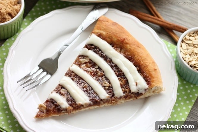 Another close-up of the Cinnamon Roll Dessert Pizza, emphasizing the texture of the oats and the glistening brown sugar mixture under the cream cheese drizzle.
