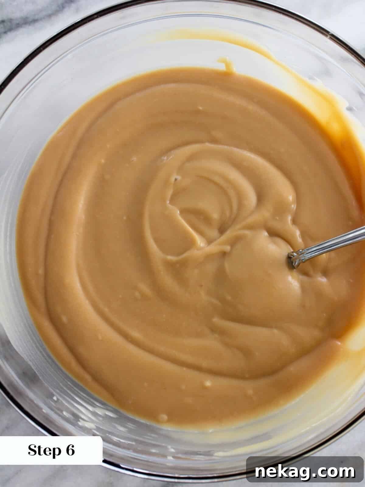 Golden Caramel Delight 7 Chilled caramel pudding in a glass cup, ready to serve.