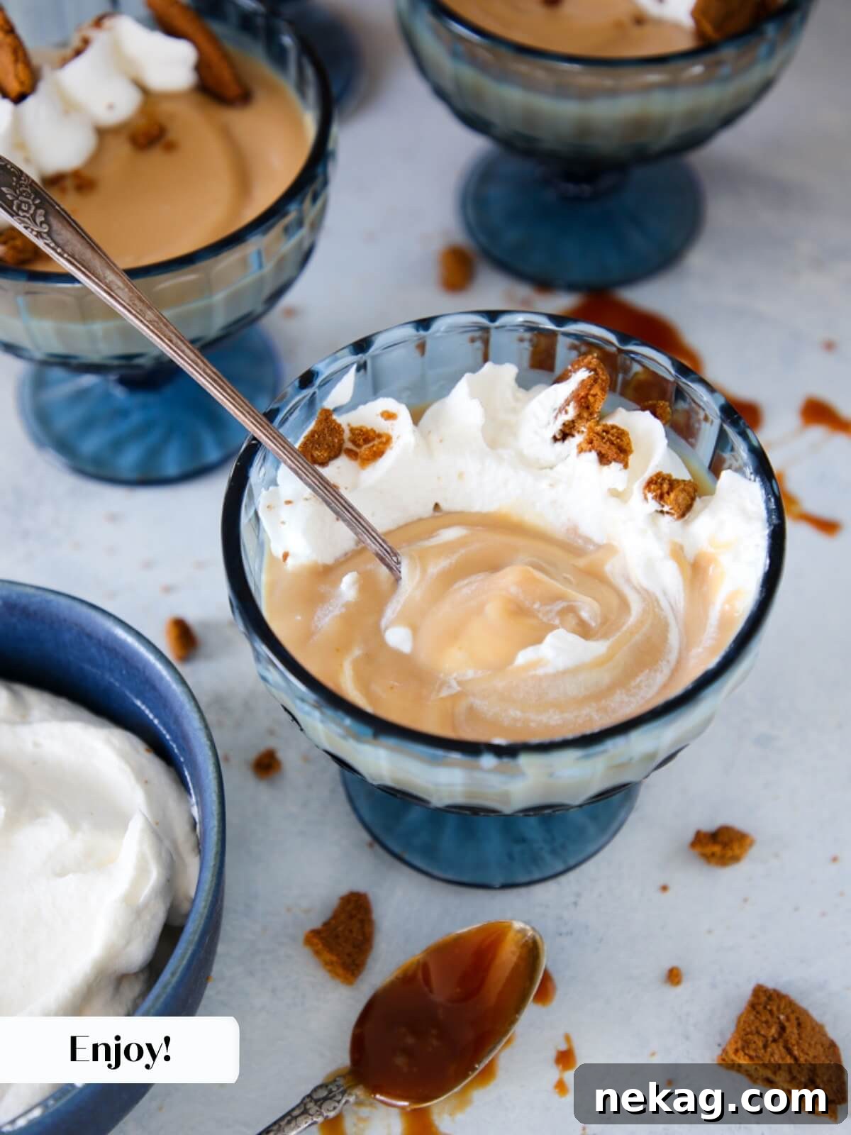 Golden Caramel Delight 8 Garnished caramel pudding with whipped cream and cookies, ready for serving.