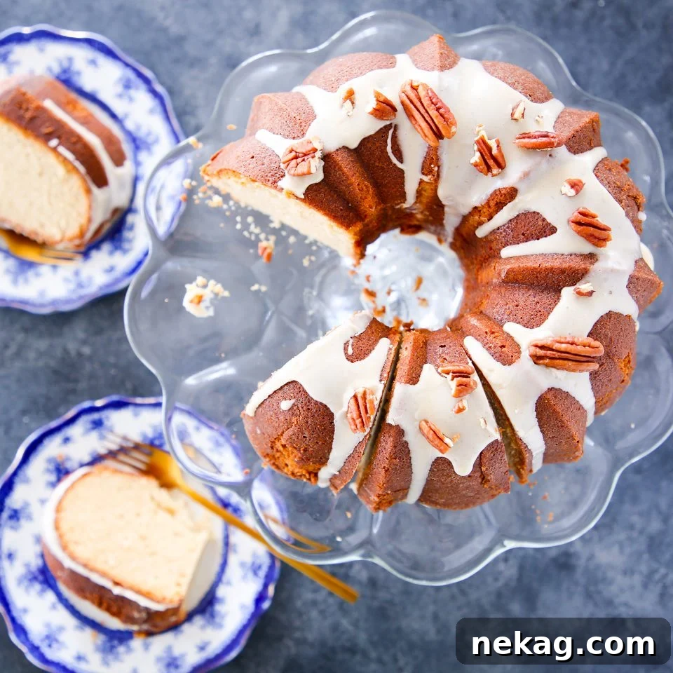 Golden Maple Glazed Pound Cake 2 Decadent Maple Pound Cake with a smooth maple glaze and toasted pecans, beautifully sliced and ready to serve.