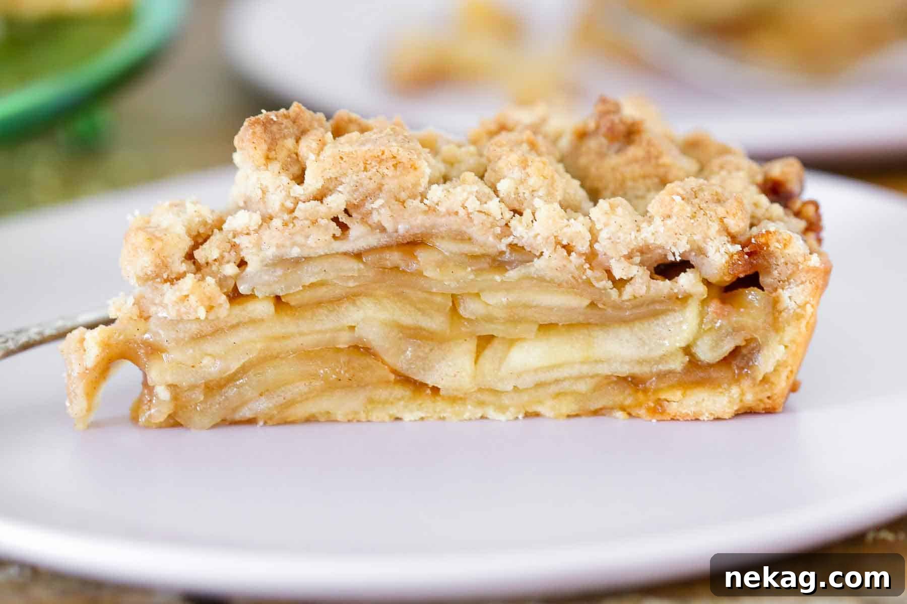 Pâte Sucrée used in a caramel apple tart, viewed from the side, showcasing its perfect golden crust.