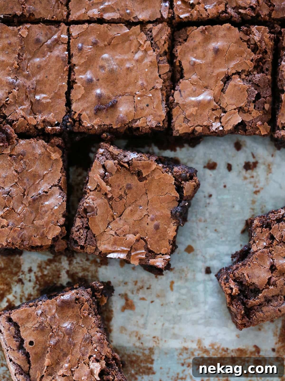 Ultimate Fudgy Brownie Perfection 13 The shiny, crinkled top of baked brownies highlighting its classic chewy texture.