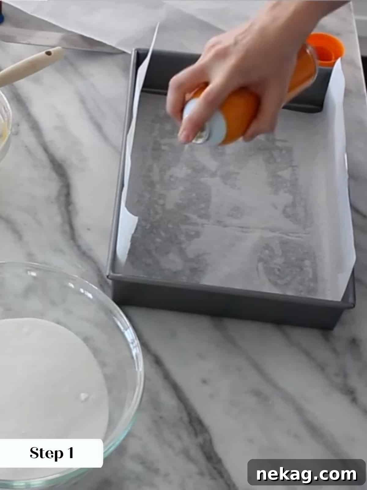 Ultimate Fudgy Brownie Perfection 6 Preparing a metal pan with parchment handles to make removing baked brownies easier later.