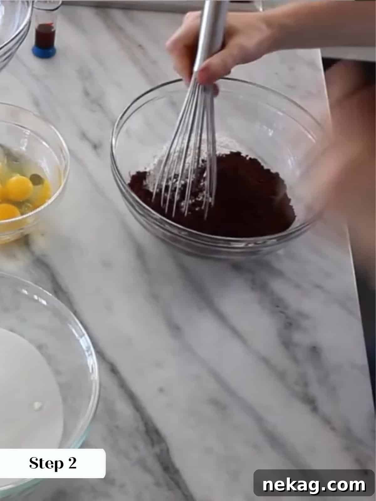 Ultimate Fudgy Brownie Perfection 7 Whisking together flour, cocoa powder, and salt in a mixing bowl for brownie batter.