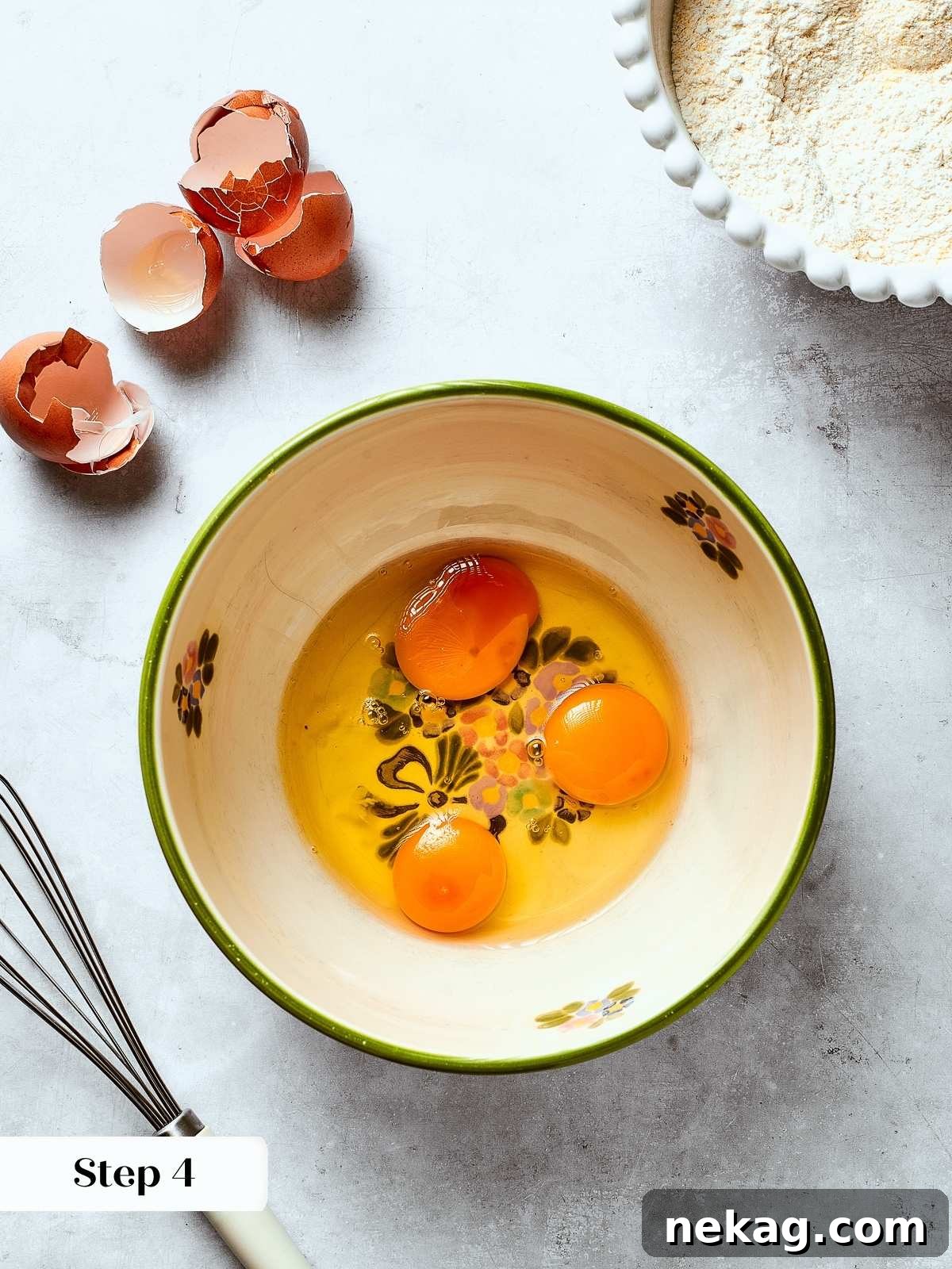 Eggs being whisked in a mixing bowl to start the base for moist Southern cornbread batter.