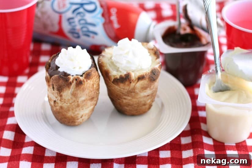 A close-up of a Woof 'Em, filled with creamy goodness and topped with whipped cream, showcasing its delicious appeal as a camping treat.