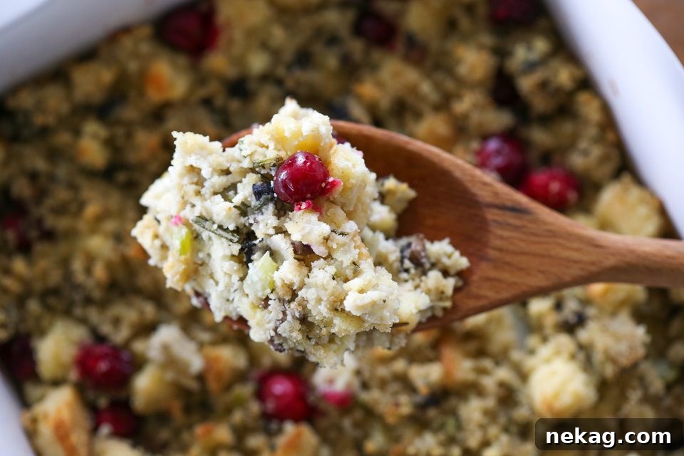 Mushroom Cornbread Stuffing, close-up with cranberries and herbs