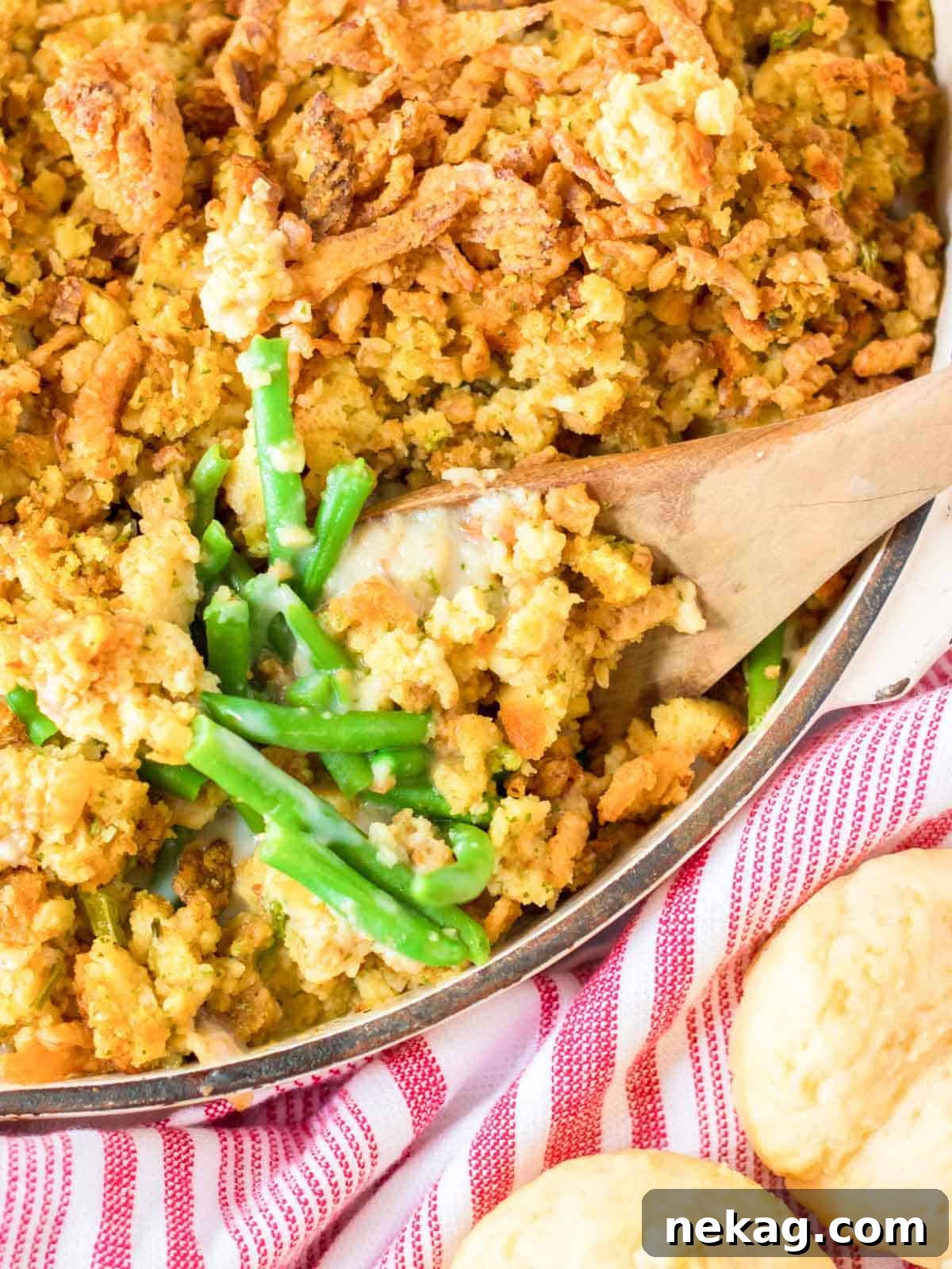 Thanksgiving Traditions A Recipe and Menu Collection 9 A classic green bean casserole presented in a dish with a serving spoon, inviting a comforting Thanksgiving meal.
