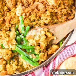 Thanksgiving Traditions A Recipe and Menu Collection 10 A hearty green bean casserole, a perfect Thanksgiving side, ready to be served with a wooden spoon.