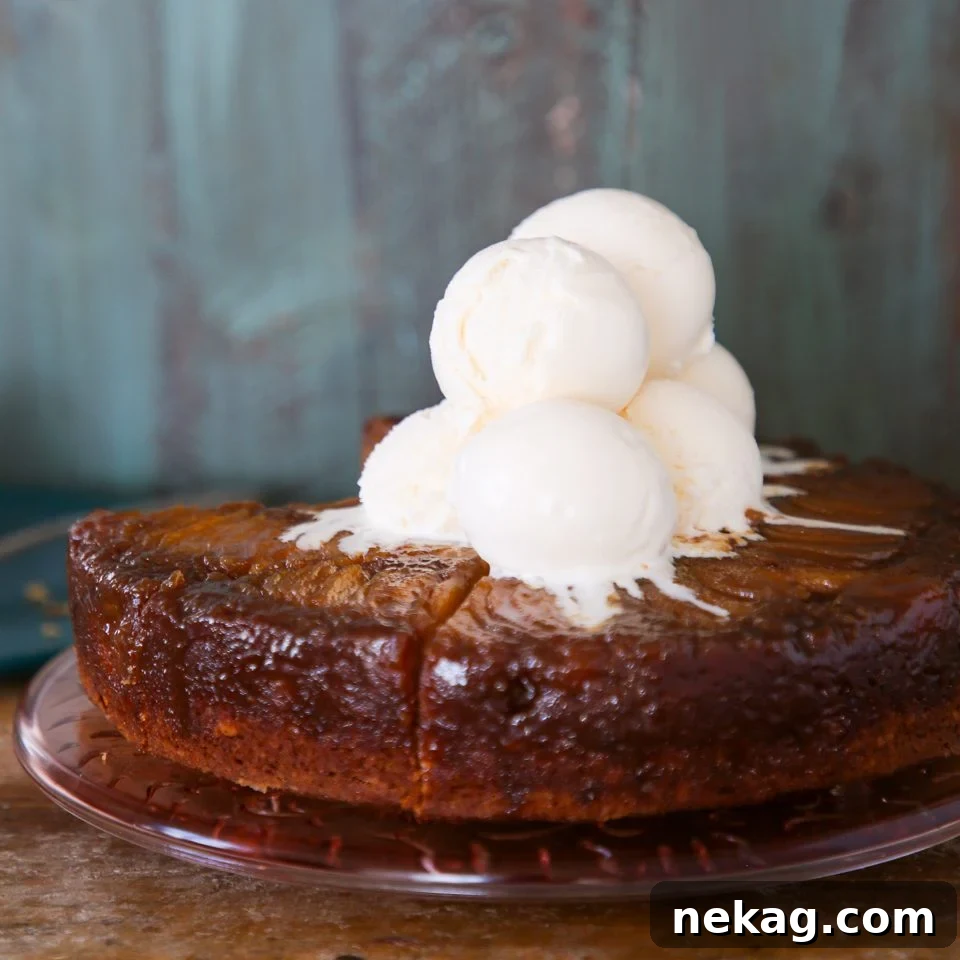 Golden Pear Flip Cake 3 Pear upside down cake with scoops of vanilla ice cream on top.