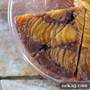 Pear Upside Down Cake sliced on a pink cake plate