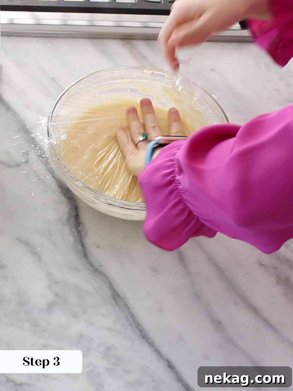 A bowl of pizzelle batter after mixing, showing its smooth and slightly thick consistency.