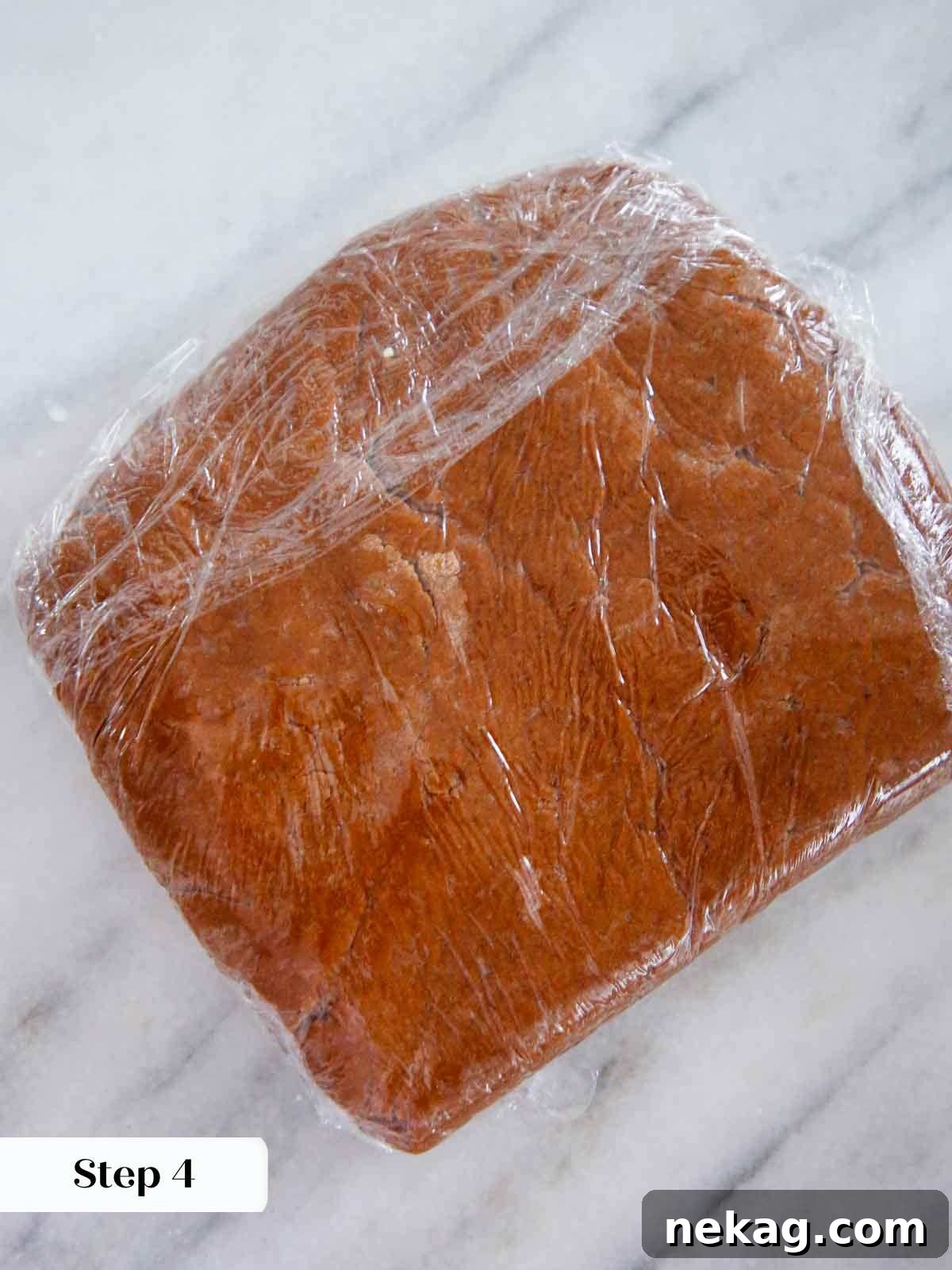 German Christmas Spice Cookies 8 Pfeffernusse dough wrapped in plastic wrap, chilling.