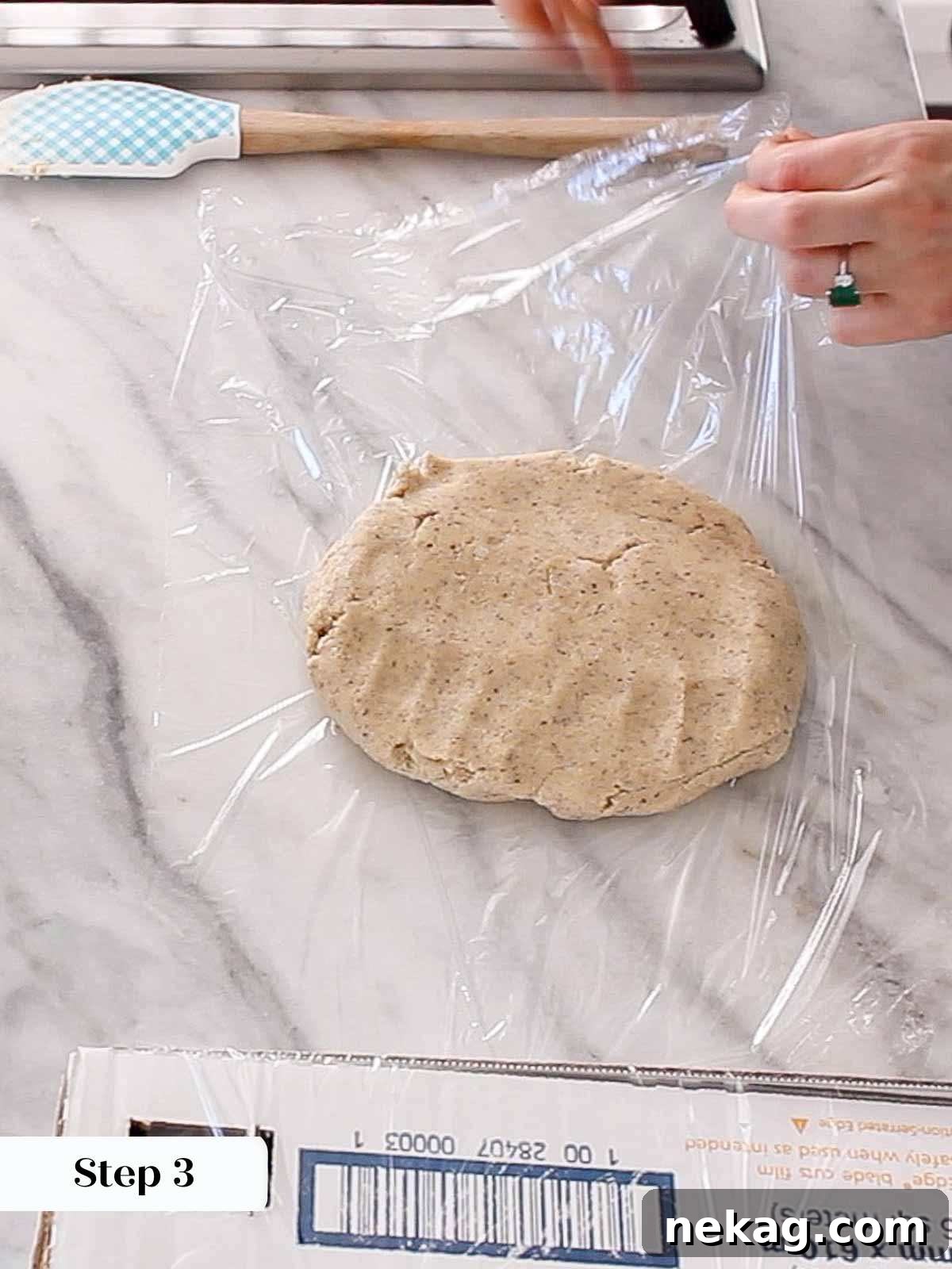 Buttery Almond Crescents 6 wrapping dough in plastic wrap.