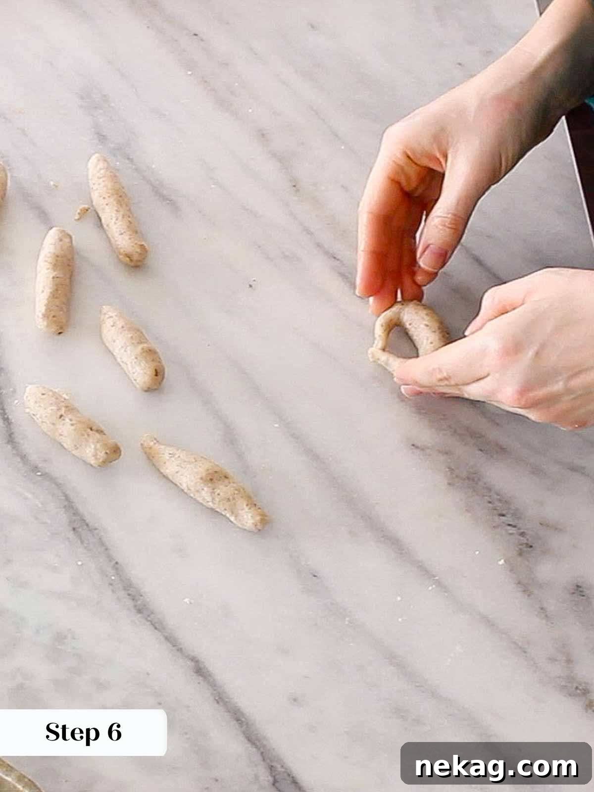 Buttery Almond Crescents 8 shaping crescent dough.