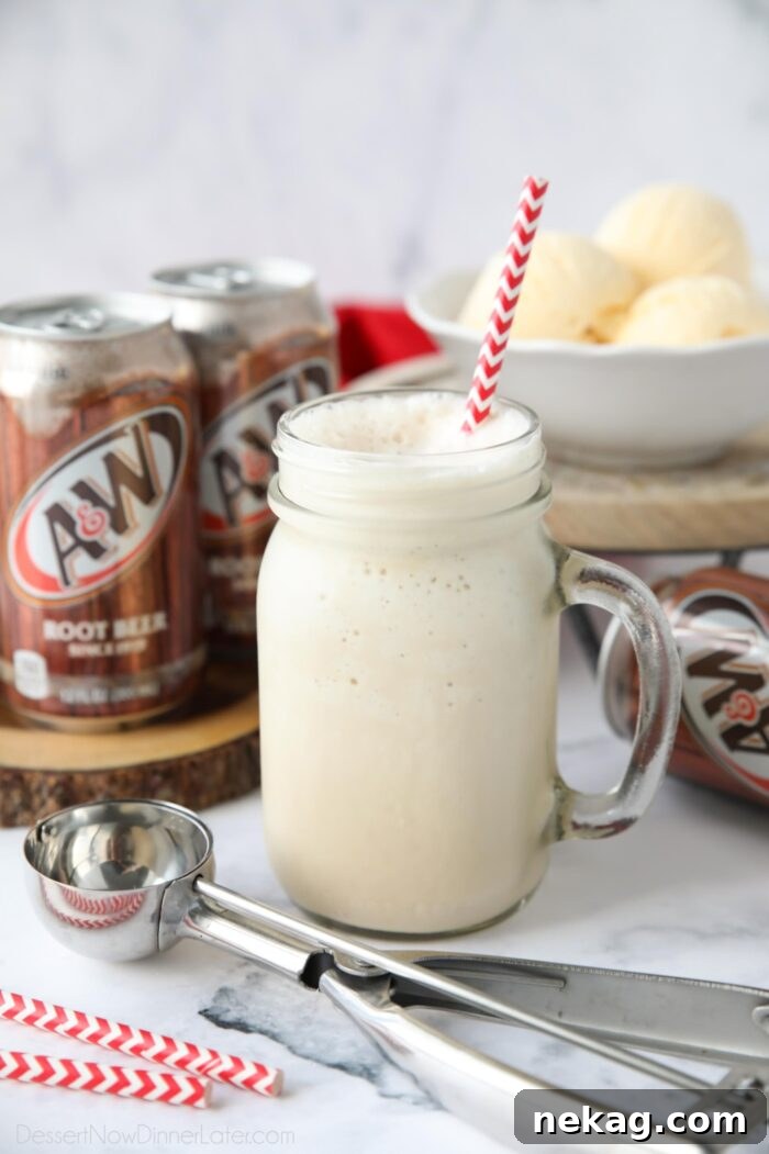 Creamy Root Beer Chill 3 A refreshing Root Beer Shake in a mason jar, complete with a straw, showcasing its creamy, blended texture.
