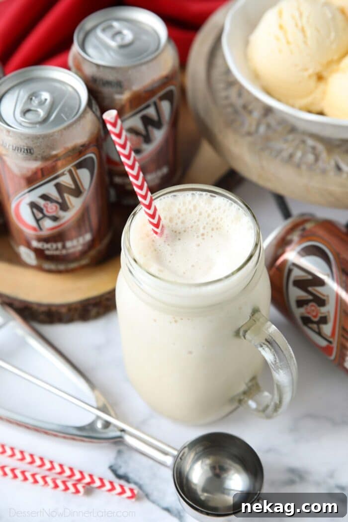 Creamy Root Beer Chill 4 A close-up of a delightful Root Beer Milkshake in a mason jar, featuring a straw and showing its smooth, blended consistency.
