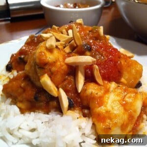 Country Captain: A Legendary Heritage Chicken Curry 3 A close-up of a rustic bowl of Country Captain Chicken Curry, highlighting the rich sauce and tender chicken pieces.