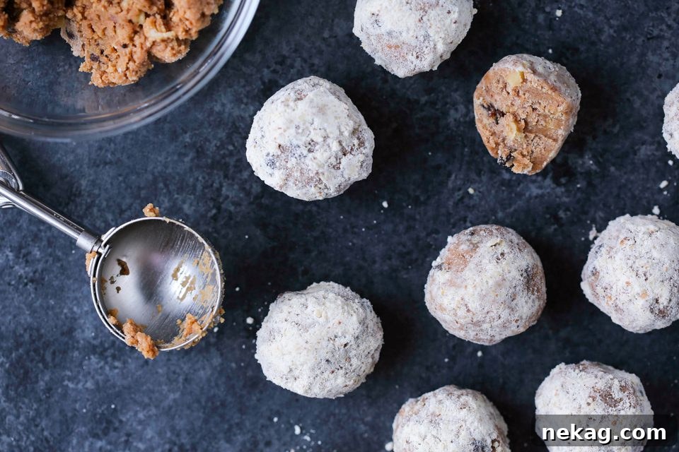 No-Bake Speculoos Rum Balls 5 A single No Bake Speculoos Cookie Drop, showcasing its sugary coating and inviting texture.