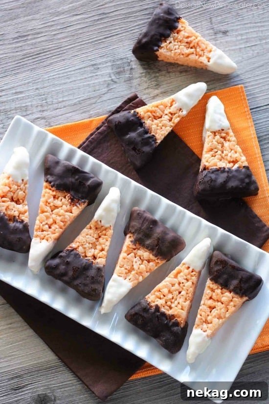 Chocolate Dipped Candy Corn Rice Krispie Treats are a fun and easy Halloween treat that the whole family will enjoy!
