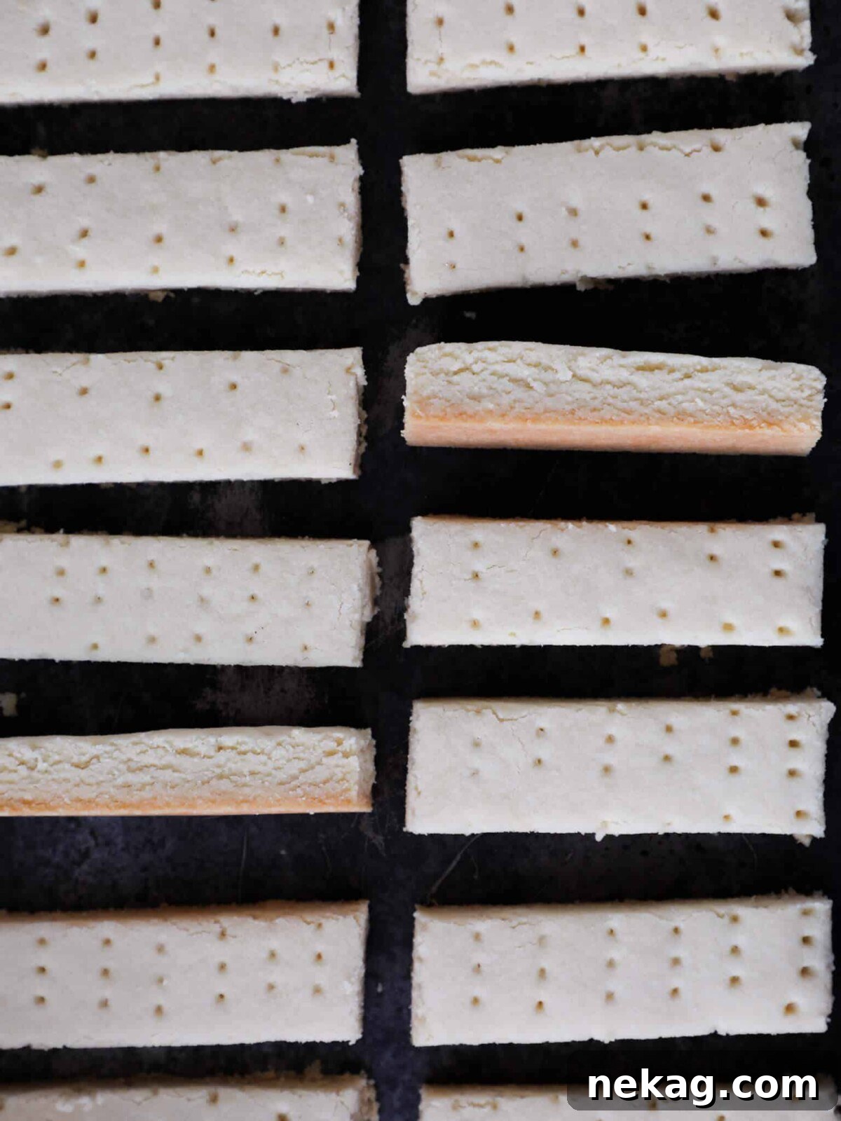 Traditional Scottish Shortbread artfully arranged on a black surface.