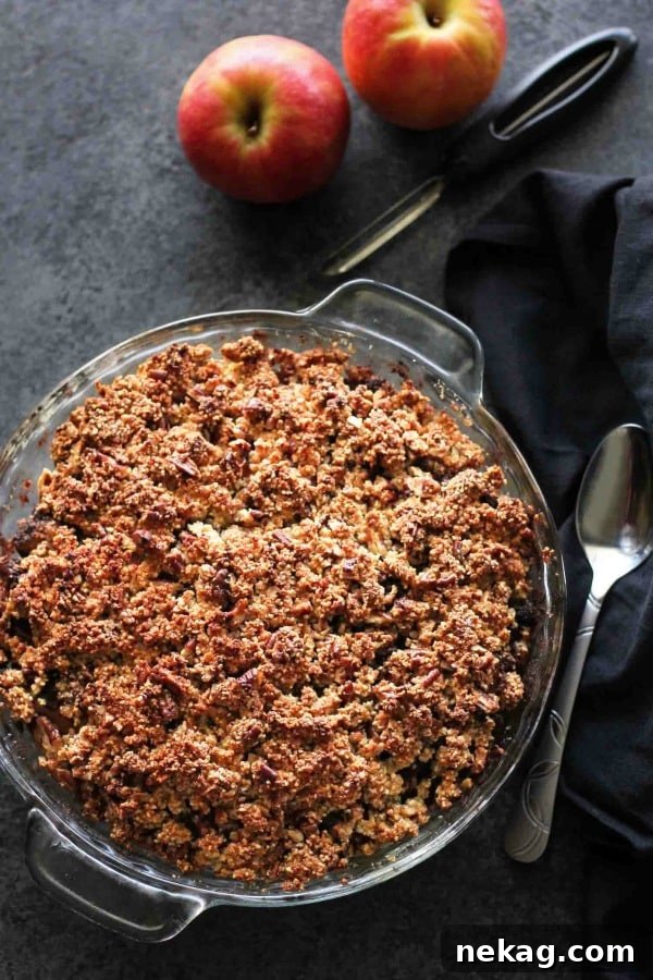 Homestyle Gluten-Free Apple Crisp 3 Close-up of the gluten-free apple crisp, showing the vibrant apple filling and the textured nut topping.