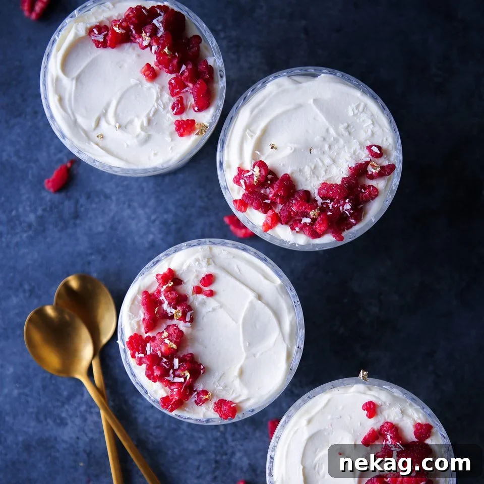 White Chocolate Raspberry Mousse in delicate glass cups, ready to be served.
