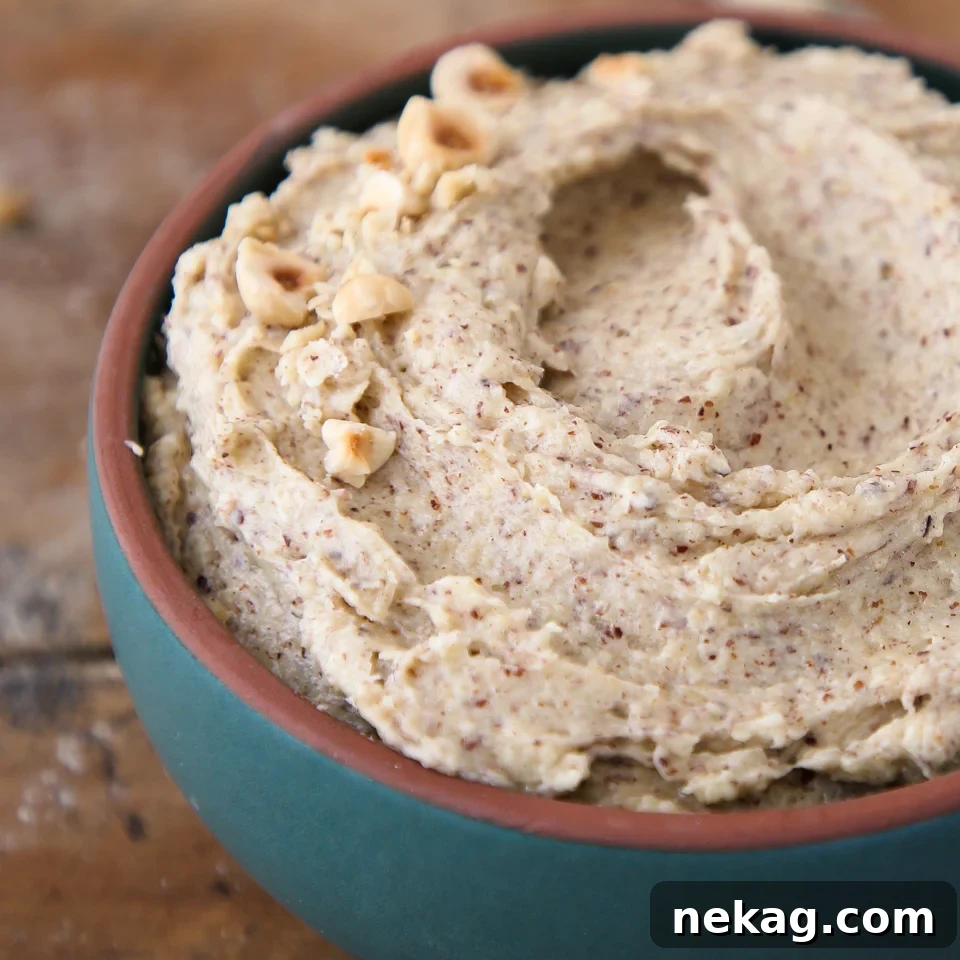 Silken Hazelnut Bliss 2 Close-up of unbaked hazelnut cream in a bowl, showcasing its smooth, creamy texture.