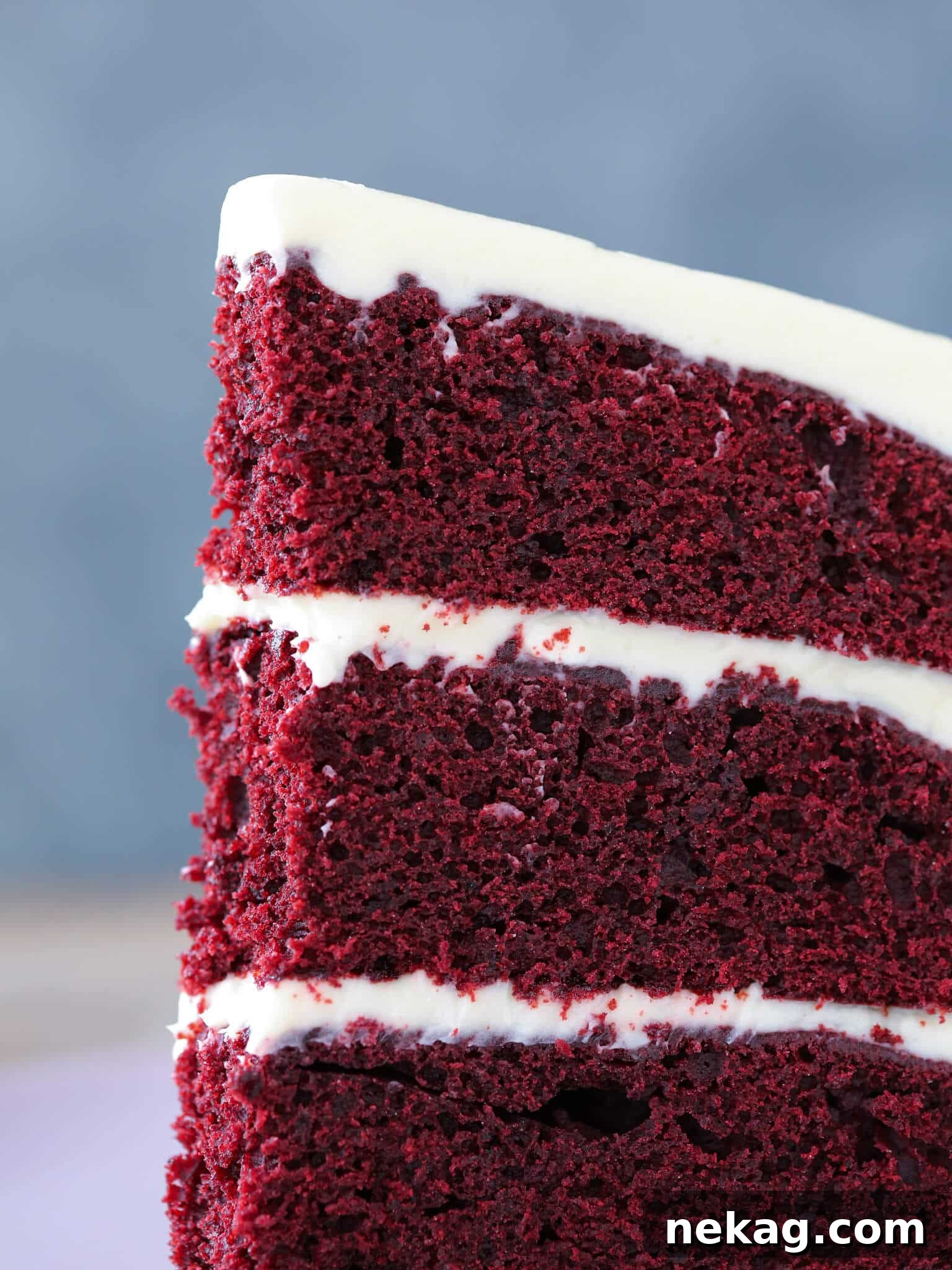 Detail of a slice of Red Velvet Layer Cake with Cream Cheese Buttercream.