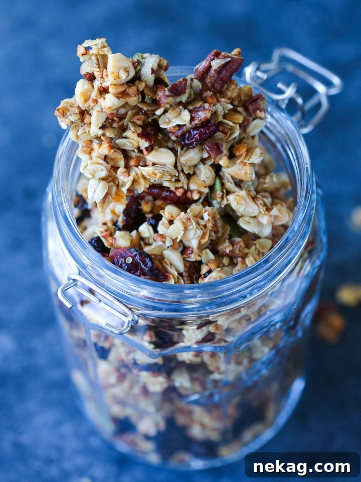 Close-up of golden brown clusters of Honey Granola, showcasing its crispy texture.