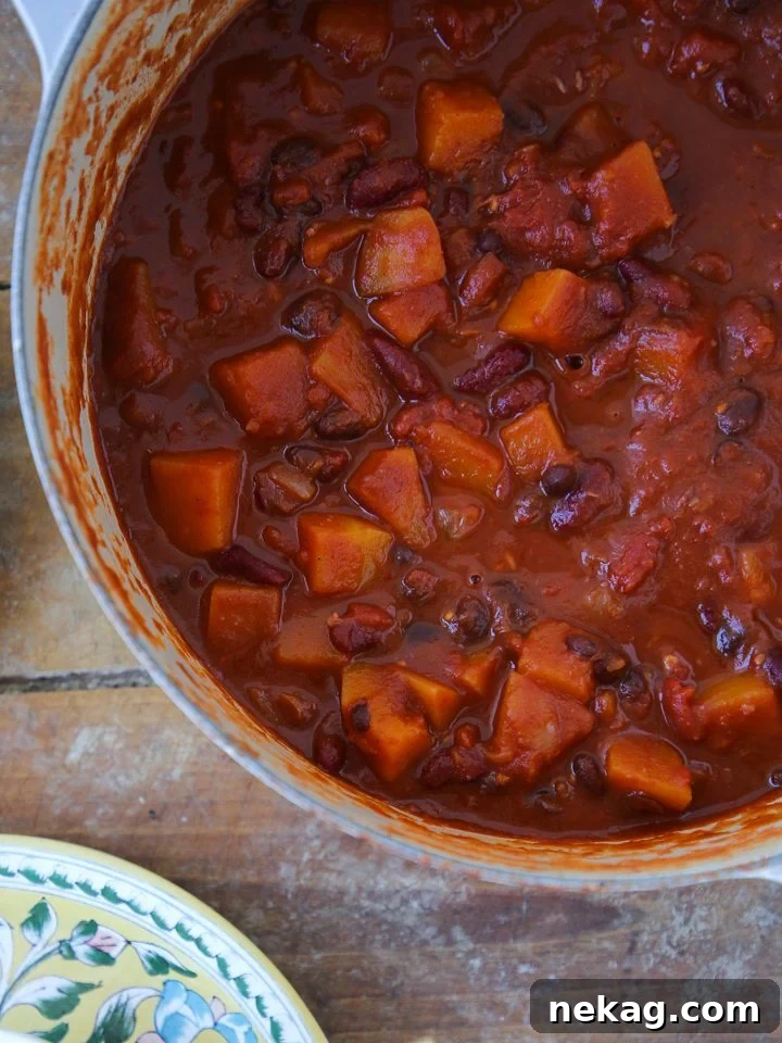 Vegan chili in a dutch oven, steaming slightly.