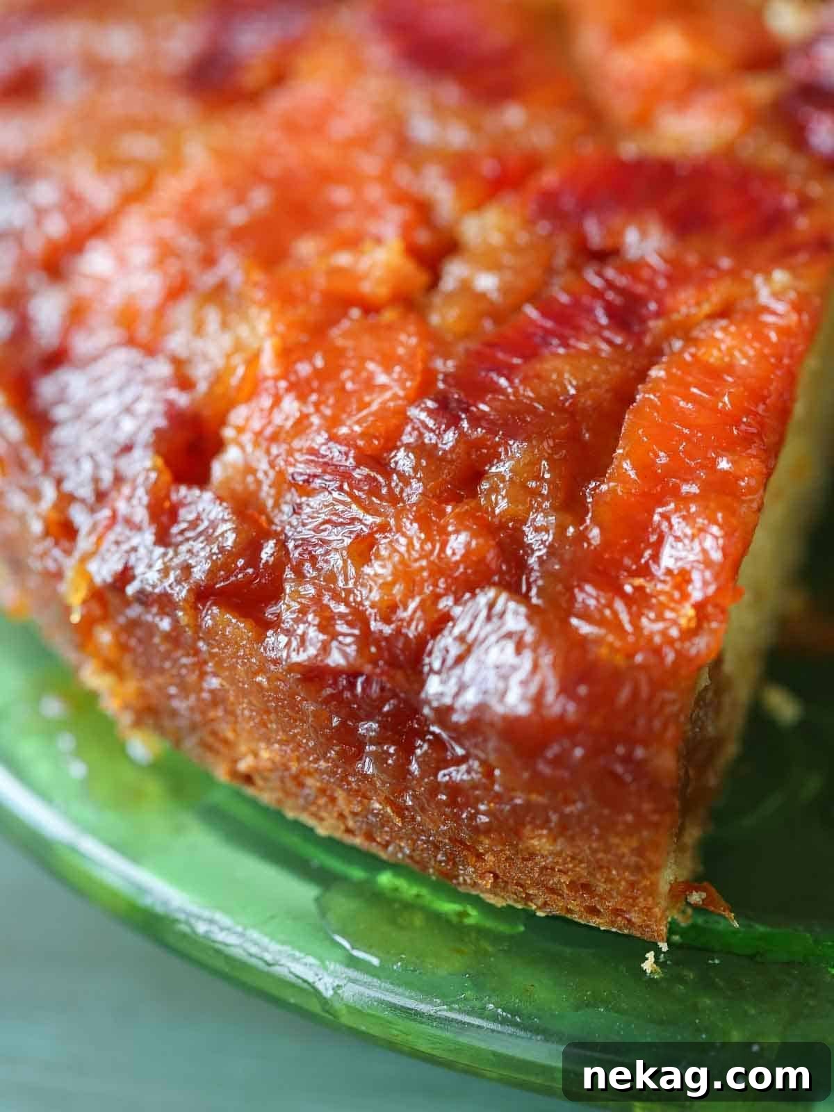 Shiny baked orange slices on a perfectly golden orange upside down cake.