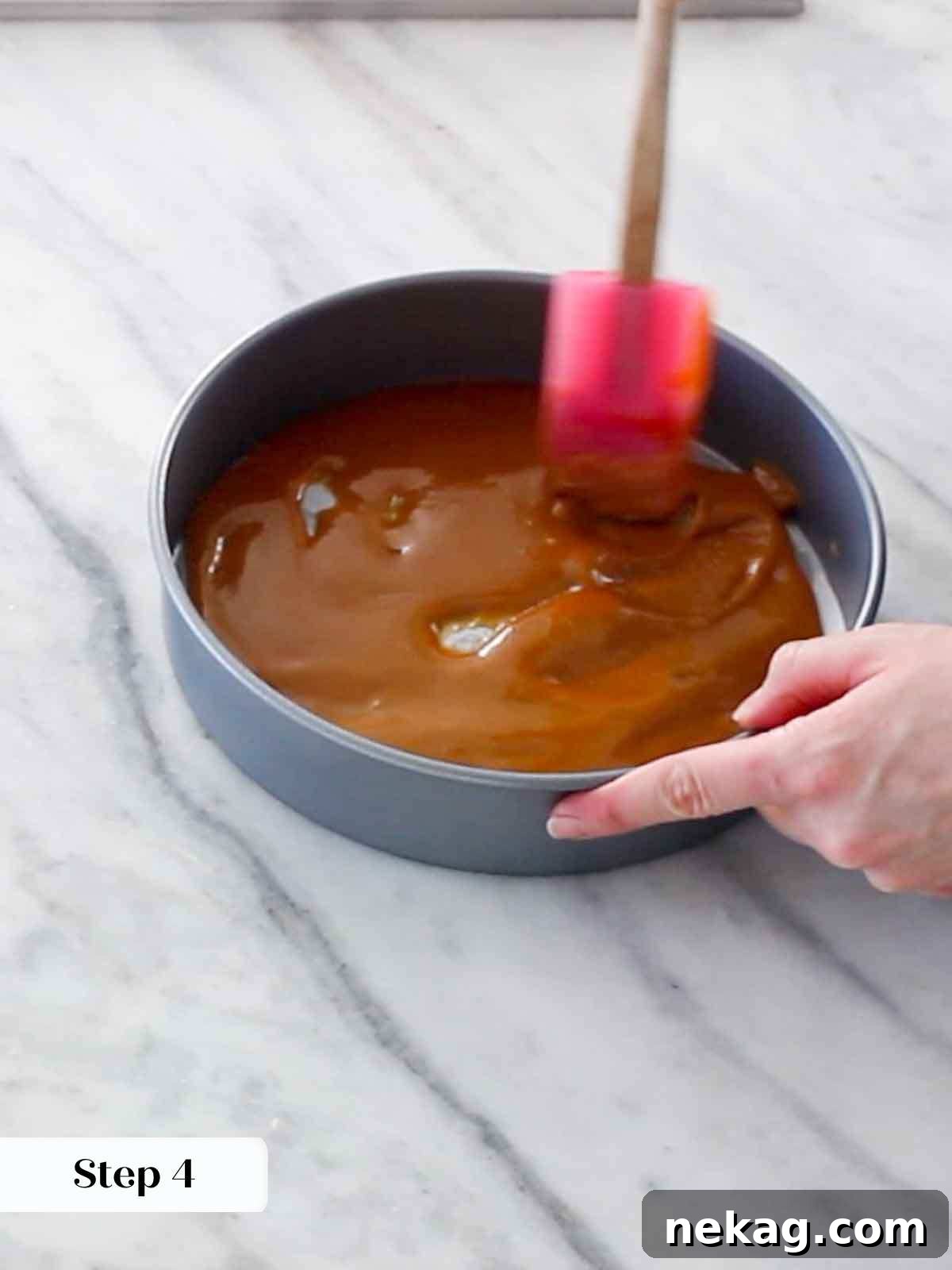 Rich caramel spread in the bottom of the cake pan, ready for oranges.