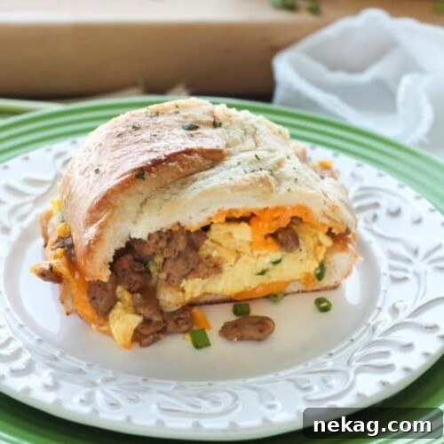 Breakfast Stuffed French Bread slices served on a plate, showcasing the filling.