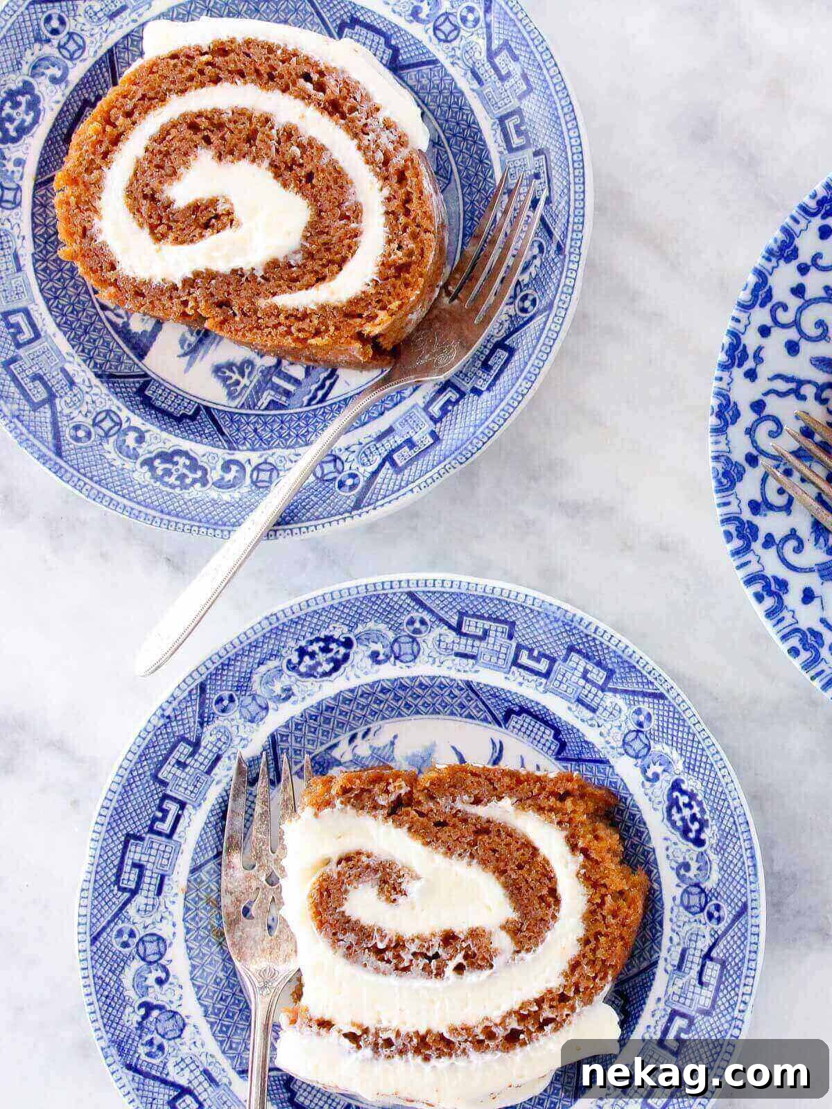Heavenly Pumpkin Roll with Cream Cheese Filling 2 Perfectly sliced pumpkin roll with visible cream cheese filling, ready to be served and enjoyed, showing moist cake layers.