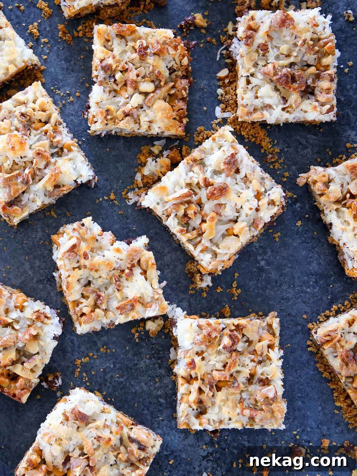 Enchanted Stacked Delights 4 sliced 7 layer bars on blue surface.