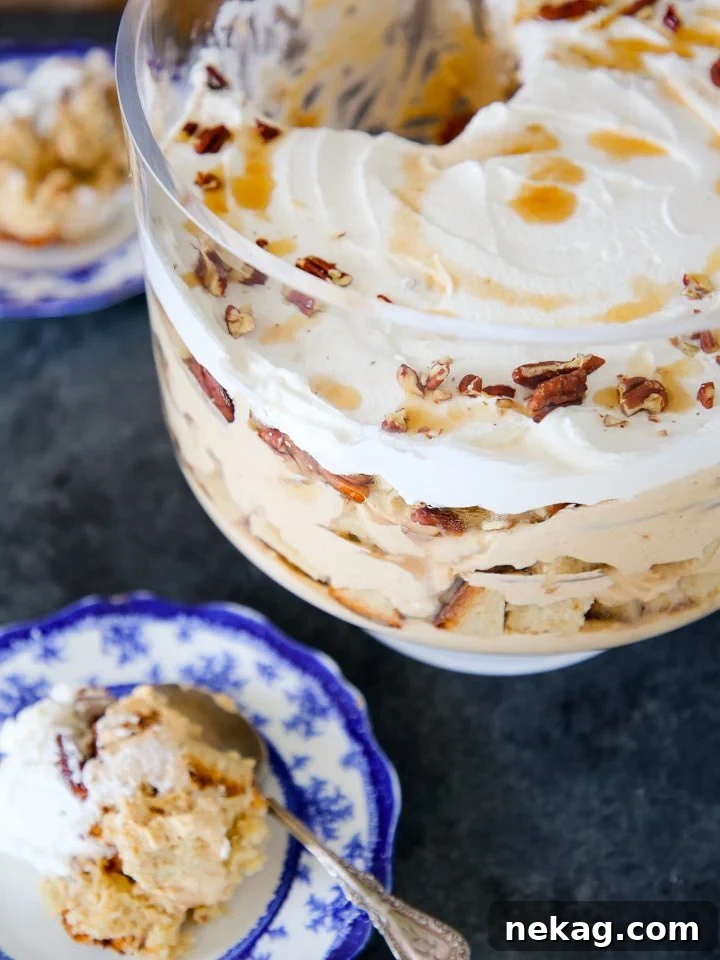 A vibrant and delicious Fall Pumpkin Dessert, layered in a clear dish.