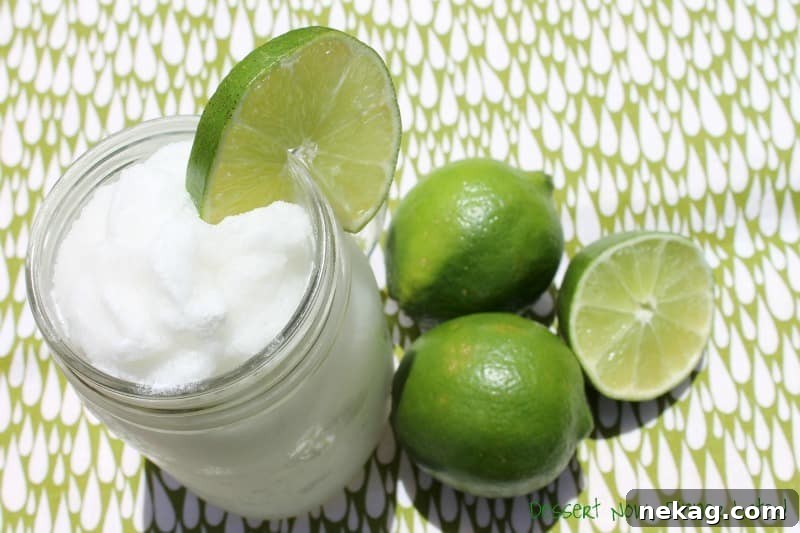 Close-up of a blender filled with ingredients for Frozen Coconut Limeade, ready to be blended.