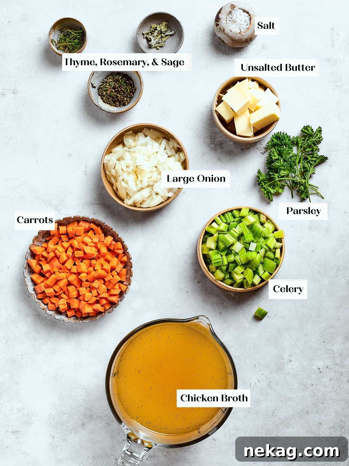 Complete preparation setup showing all ingredients for Southern cornbread dressing before mixing and baking, including chopped vegetables and herbs.