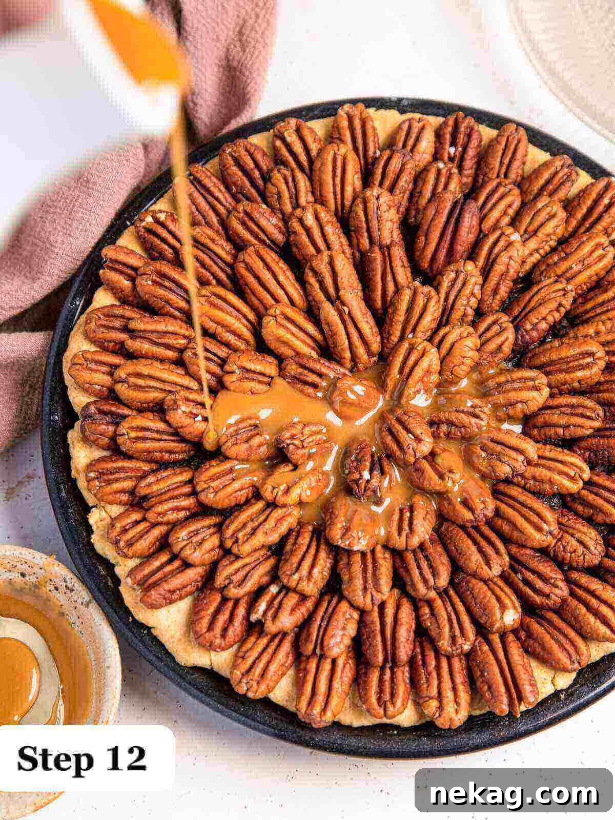 Decadent Chocolate Pecan Pie 12 Step-by-step image capturing the moment rich caramel sauce is poured generously over a baked chocolate pecan pie, creating a beautiful glaze.