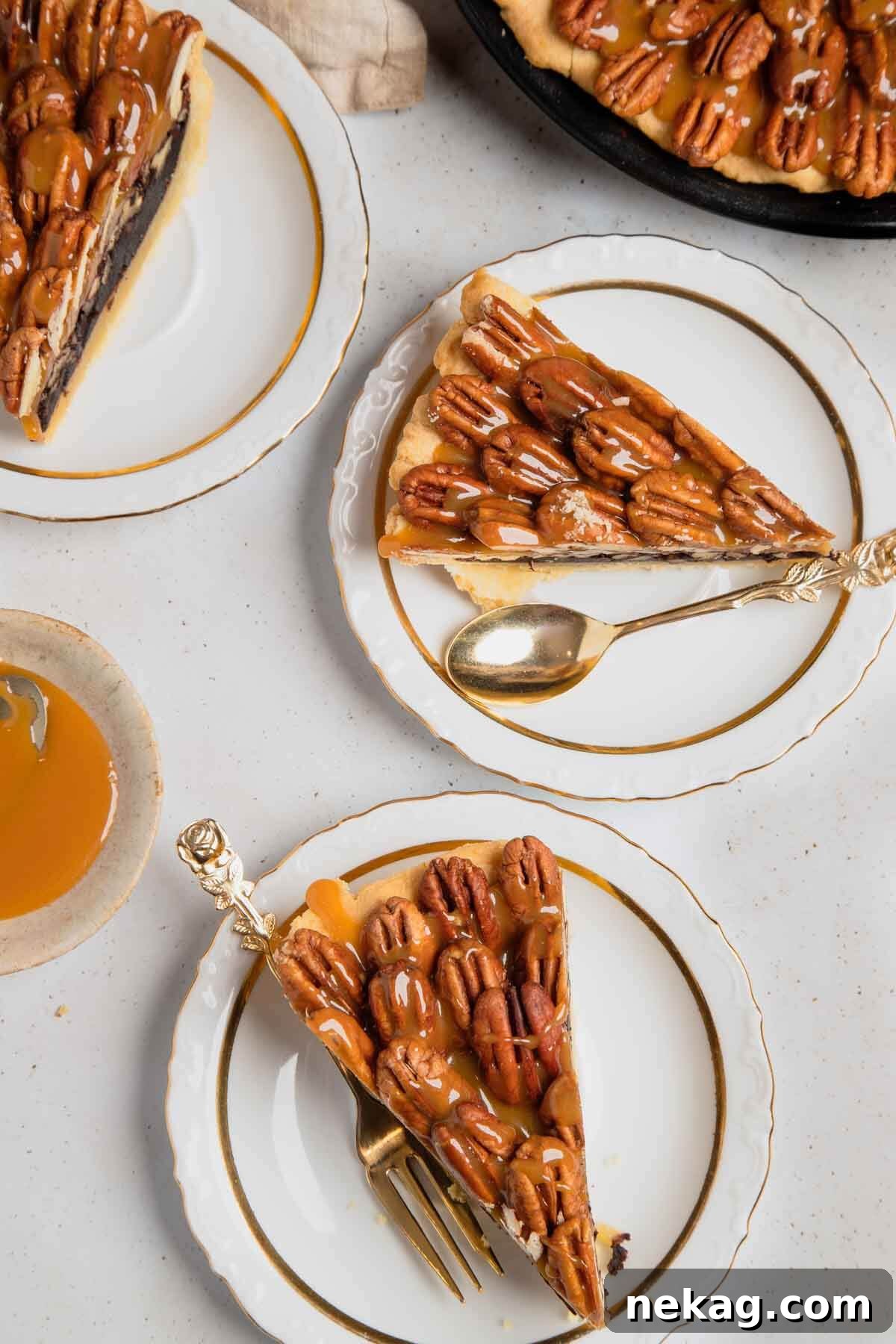 Decadent Chocolate Pecan Pie 13 Two elegant, perfectly sliced pieces of chocolate pecan pie, each presented on a pristine white plate, showcasing the layers.