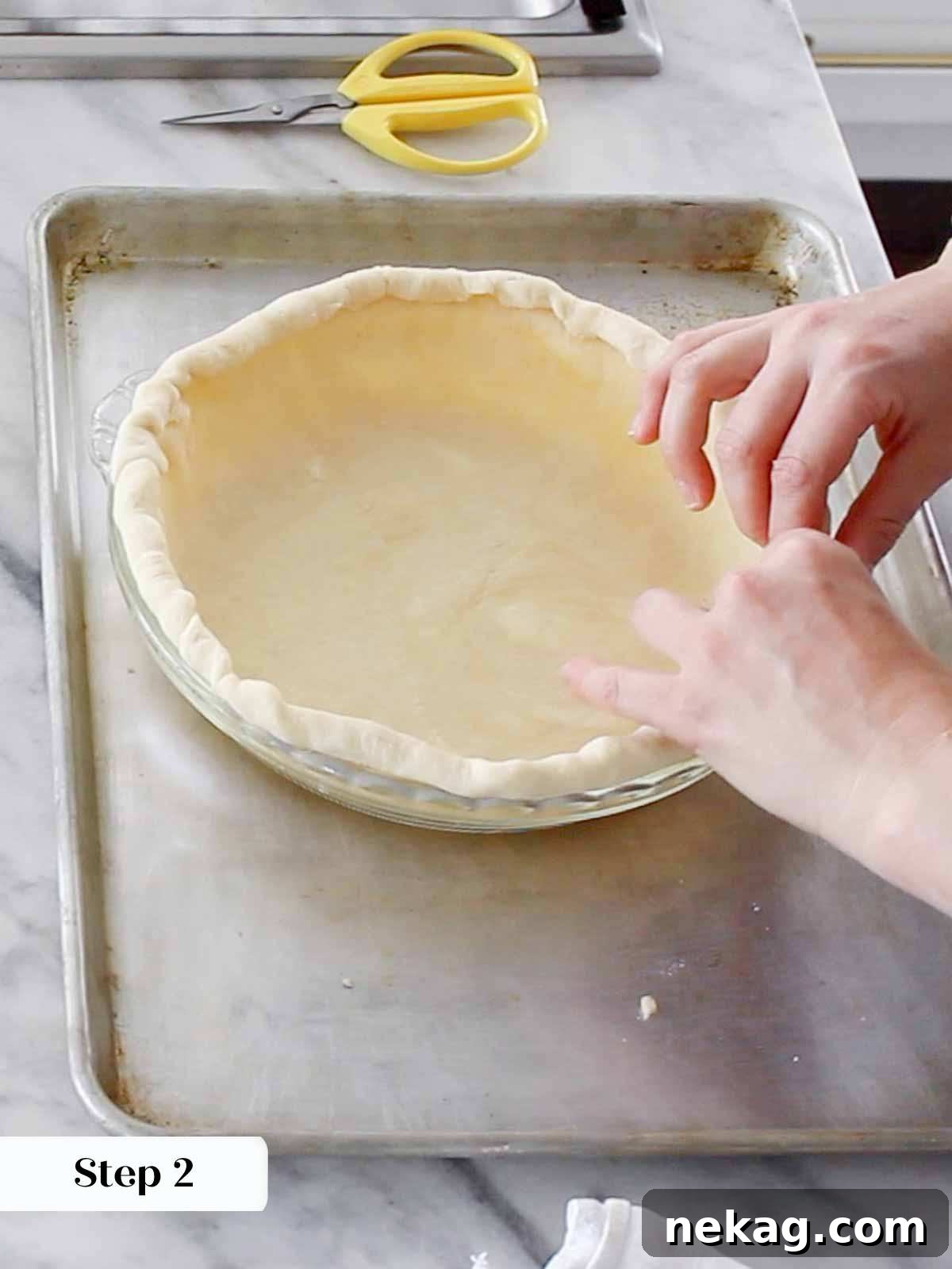 Decadent Pecan Pie Perfection 5 Fitting pie dough into a pie pan, ensuring a snug and even fit for blind baking.